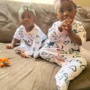 White black and pink onesie with footies
